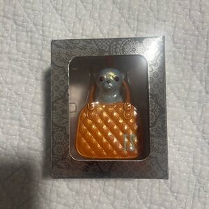 A toy chihuahua barking at me from a tiny purse Life of a Showgirl ornament
